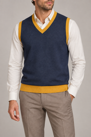 Quiet Layer V-Neck Vest in Navy with Mustard Trim, elegantly layered on a male model, close front hero.