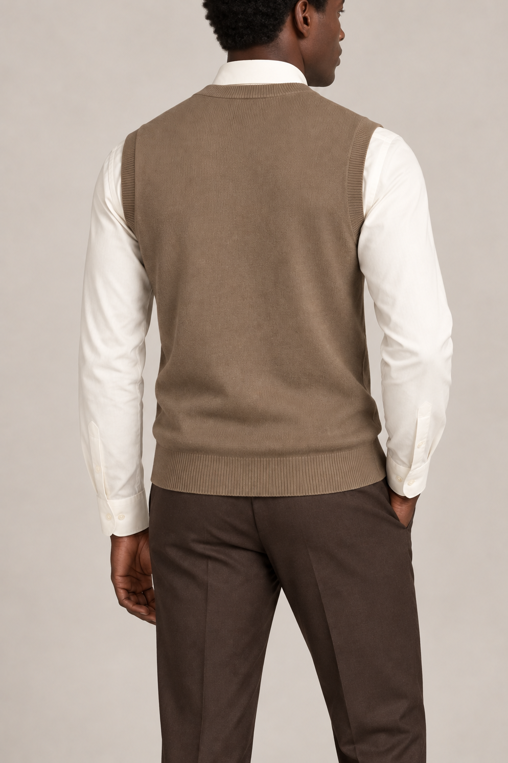 Quiet Layer V-Neck Vest in Peanut, elegantly layered on a male model, rear three-quarter view.