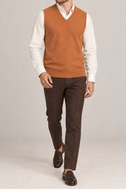 Quiet Layer V-Neck Vest in Rust, elegantly layered on a male model, full outfit front view.