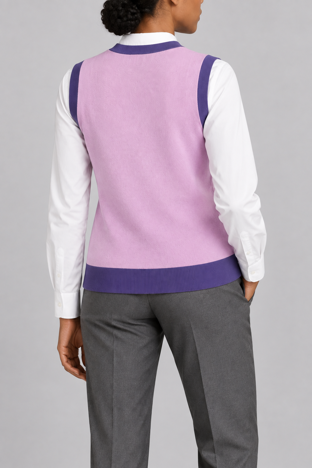 Soft Outline V-Neck Vest in Lilac with Violet Trim, elegantly layered on a female model, rear three-quarter view.