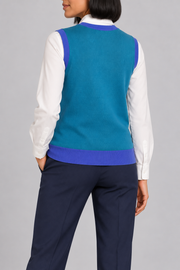 Soft Outline V-Neck Vest in Cyan with Royal Trim, elegantly layered on a female model, rear three-quarter view.