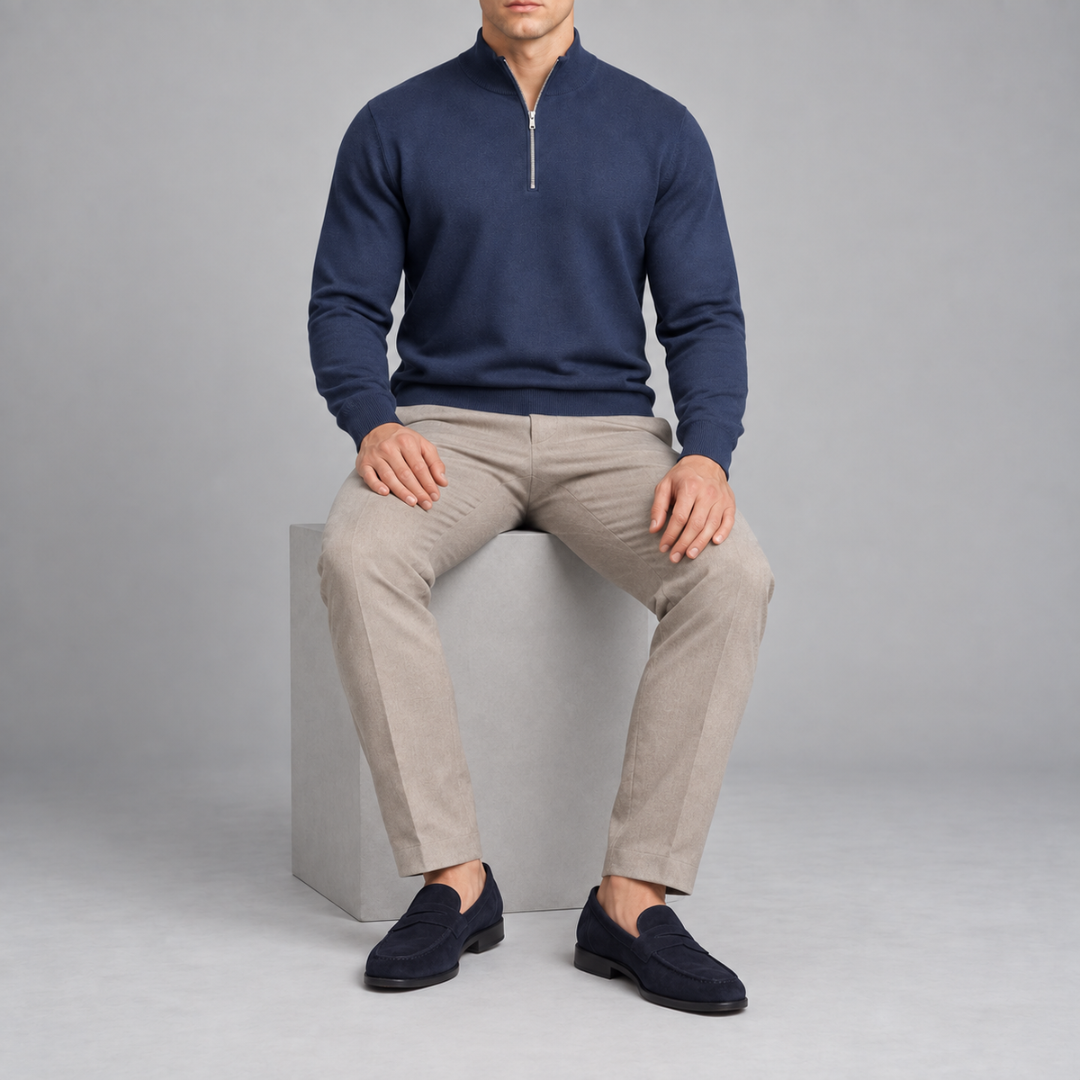 Seated studio view showing the Navy knit drape and long sleeves of Open Pace Quarter-Zip Sweater in Navy.