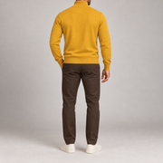 Rear studio view showing the plain Mustard back and ribbed hem of Open Pace Quarter-Zip Sweater in Mustard.