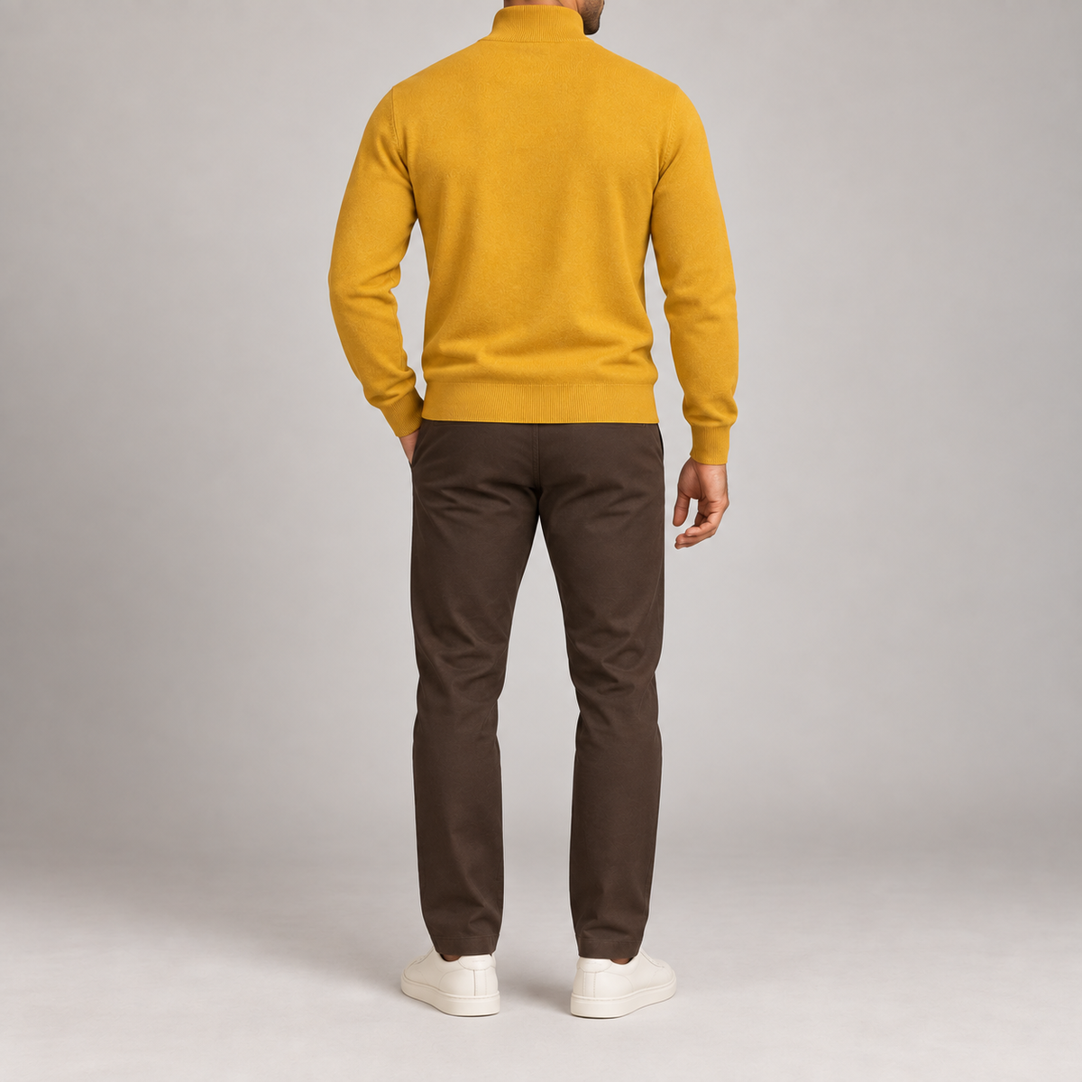 Rear studio view showing the plain Mustard back and ribbed hem of Open Pace Quarter-Zip Sweater in Mustard.