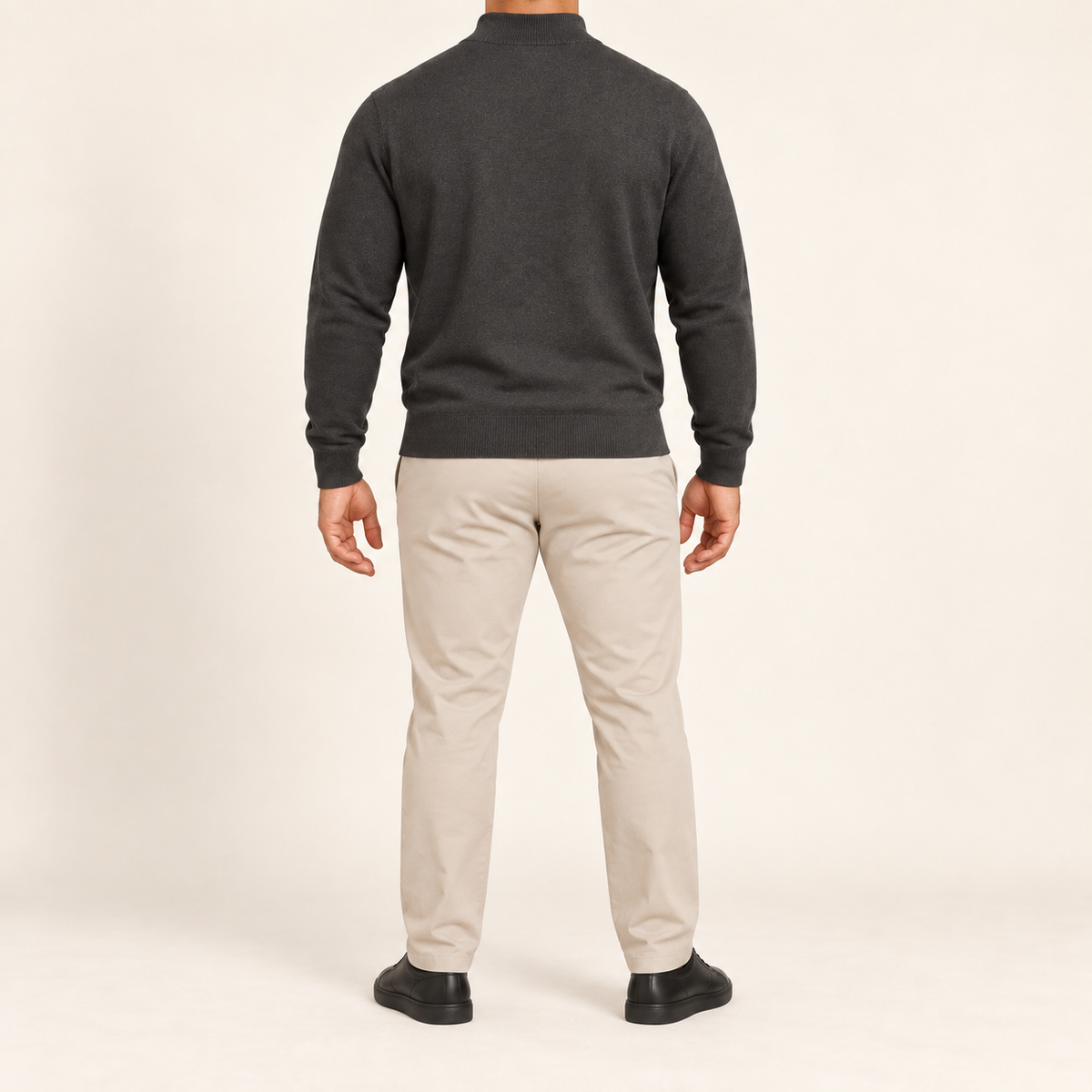 Rear studio view showing the Charcoal back and tonal ribbed hem of Open Pace Quarter-Zip Sweater in Charcoal.