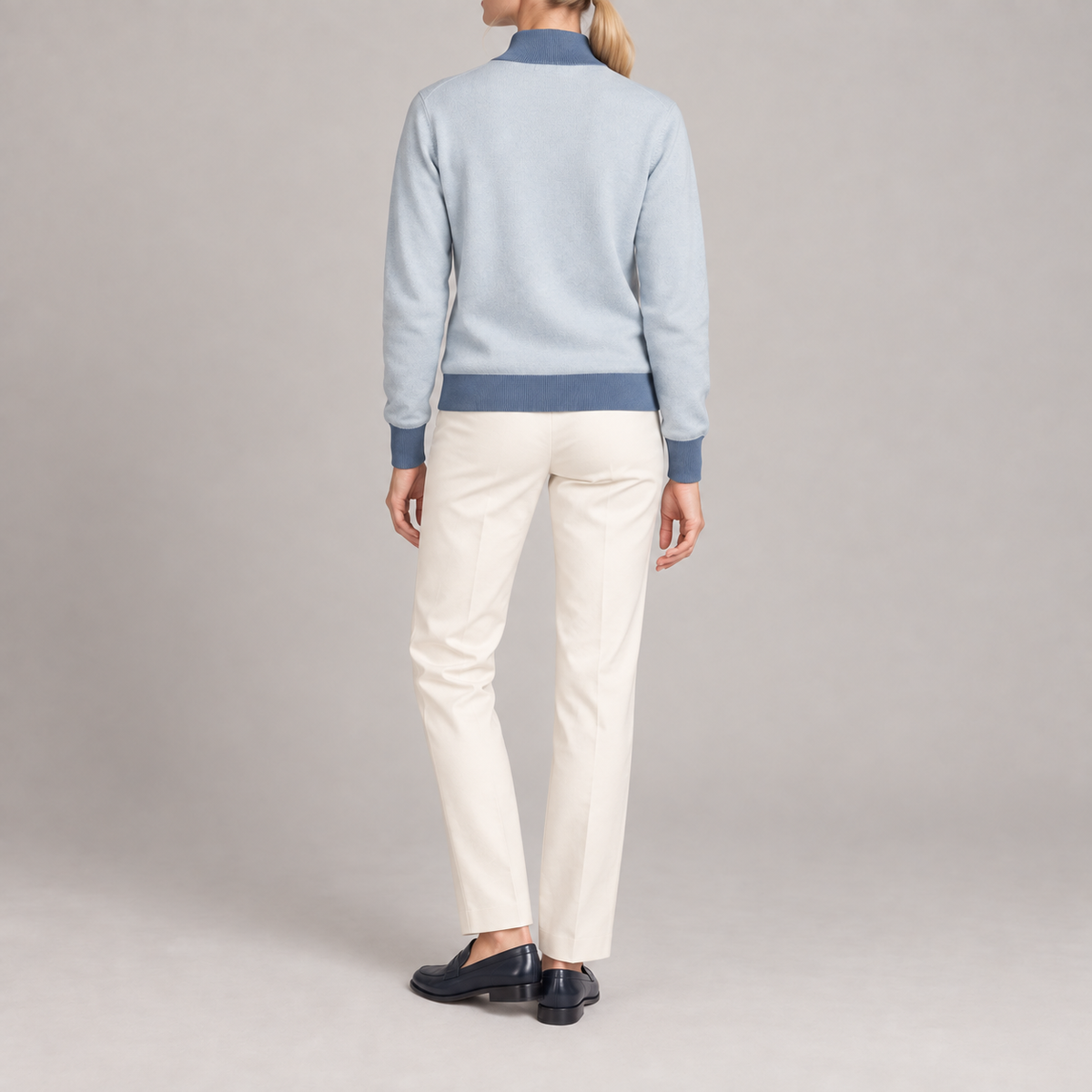 Rear studio view showing the plain Powder back and Denim trim of Soft Pace Quarter-Zip in Powder with Denim Trim.