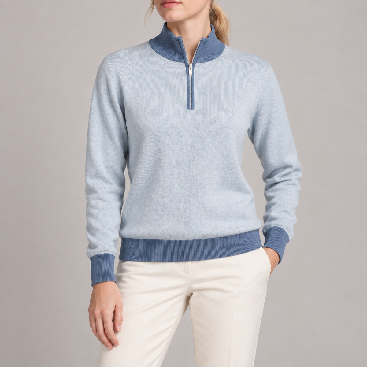 Close-up showing Powder knit texture Denim collar and short silver zipper of Soft Pace Quarter-Zip in Powder with Denim Trim.