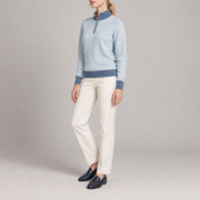 Three-quarter studio view showing the Powder silhouette with Denim ribbed trim of Soft Pace Quarter-Zip in Powder with Denim Trim.