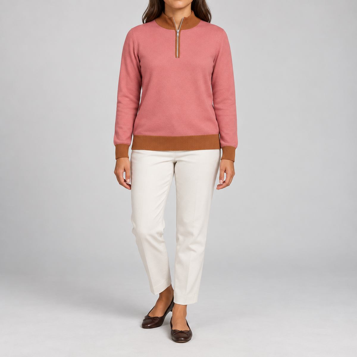 Front studio view showing Coral knit with Rust collar cuffs and hem of Soft Pace Quarter-Zip in Coral with Rust Trim.