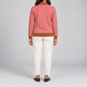 Rear studio view showing the plain Coral back and Rust trim of Soft Pace Quarter-Zip in Coral with Rust Trim.