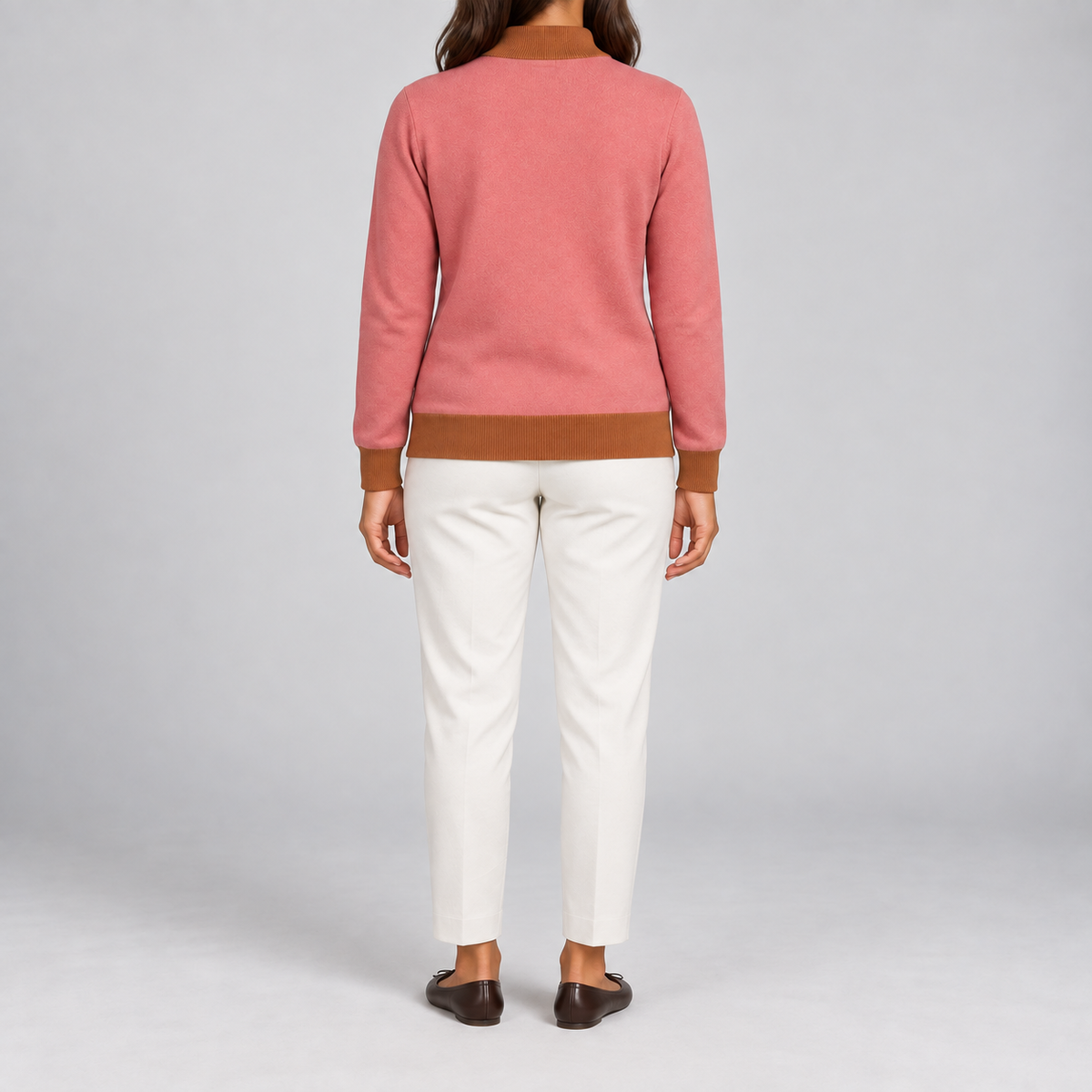 Rear studio view showing the plain Coral back and Rust trim of Soft Pace Quarter-Zip in Coral with Rust Trim.