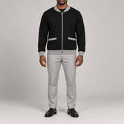 Front studio view showing full zip and grey-trimmed patch pockets of Afterlight Knit Bomber in Black with Grey Trim.