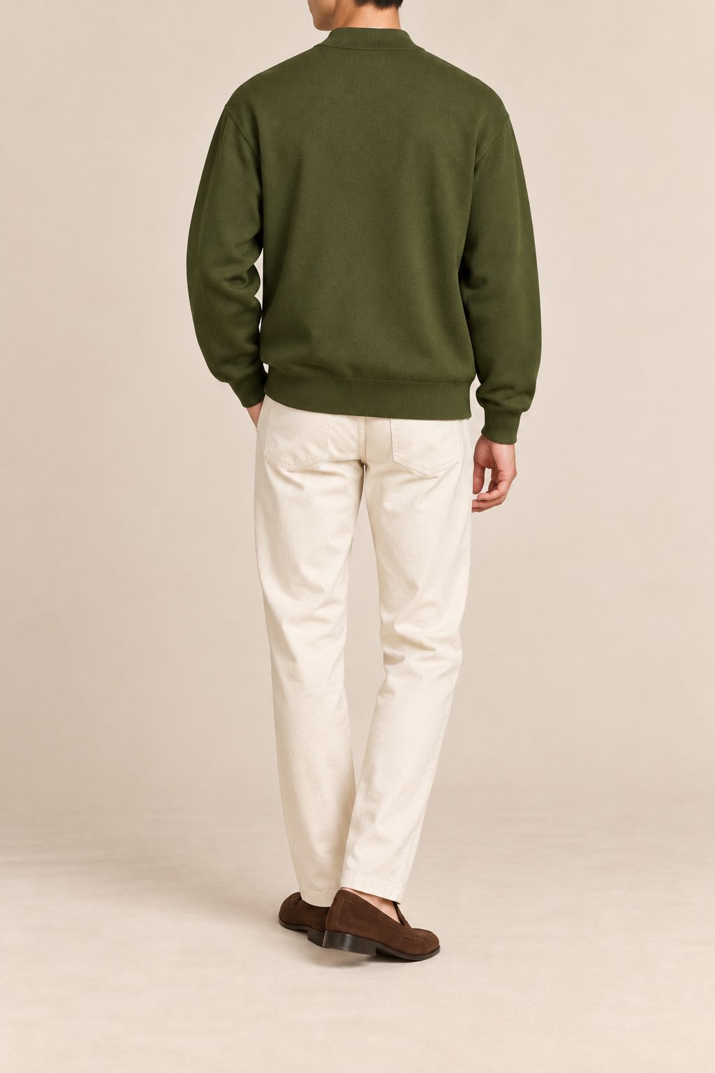 Rear studio view showing plain knit back and ribbed hem of Afterlight Knit Bomber in Olive.