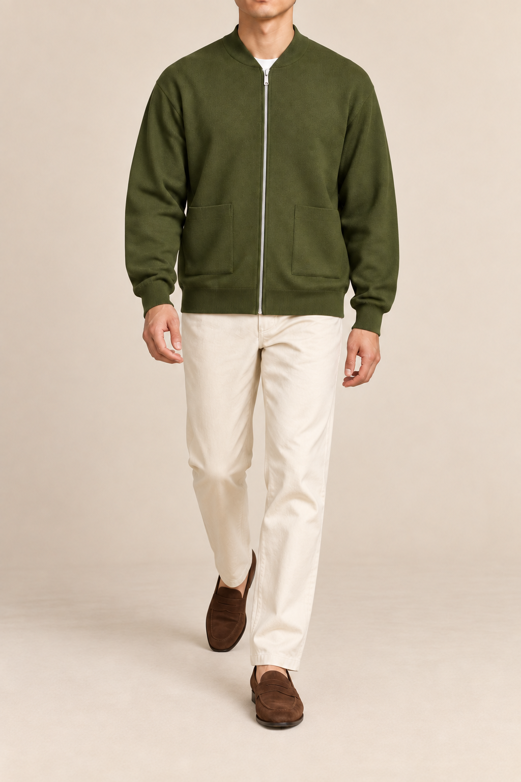Walking studio view showing knit drape of Afterlight Knit Bomber in Olive.