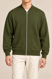 Close-up studio view showing low collar, zipper and fine knit texture of Afterlight Knit Bomber in Olive.