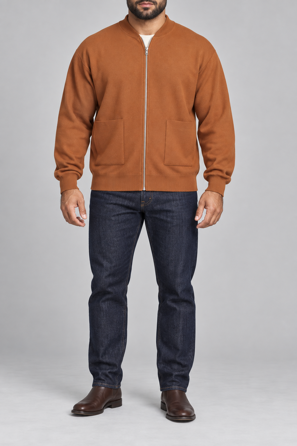 Front studio view showing full zip and front pockets of Afterlight Knit Bomber in Rust.