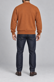 Rear studio view showing plain knit back and ribbed hem of Afterlight Knit Bomber in Rust.