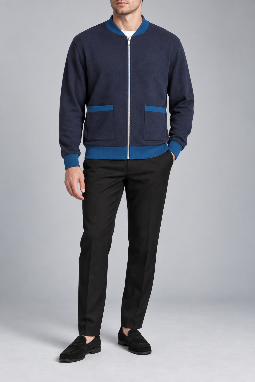 Front studio view showing full zip and front pockets of Afterlight Knit Bomber in Navy with Yale Blue Trim.