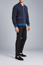 Three-quarter studio view showing the bomber silhouette of Afterlight Knit Bomber in Navy with Yale Blue Trim.