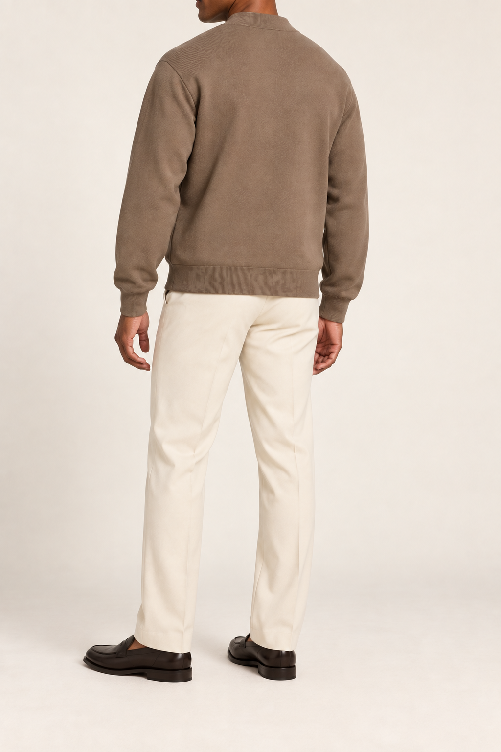 Rear studio view showing plain knit back and ribbed hem of Afterlight Knit Bomber in Peanut.