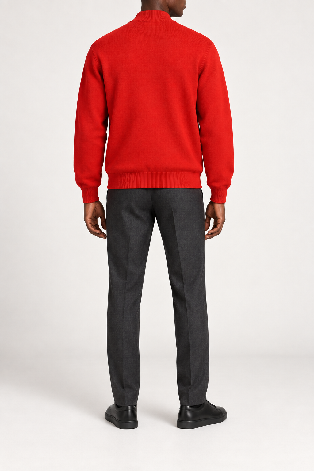Rear studio view showing plain knit back and ribbed hem of Afterlight Knit Bomber in Chili.