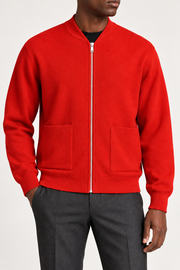 Close-up studio view showing low collar, zipper and fine knit texture of Afterlight Knit Bomber in Chili.