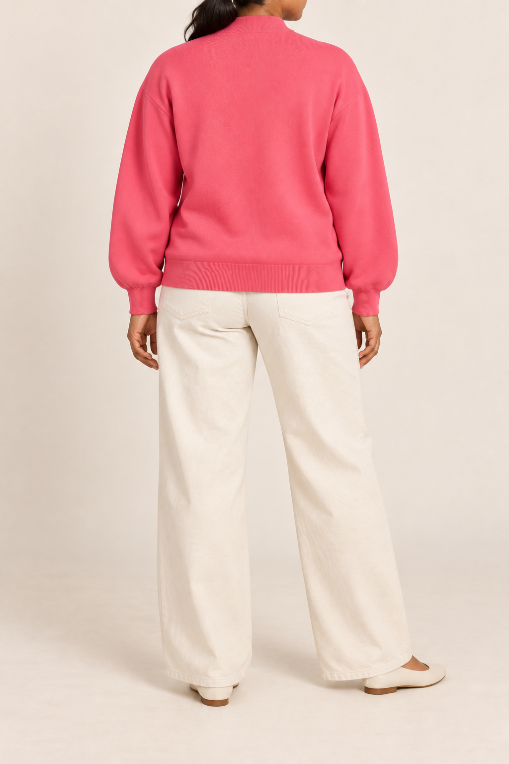 Rear studio view showing plain knit back and ribbed hem of Soft Afterlight Knit Bomber in Hot Pink.