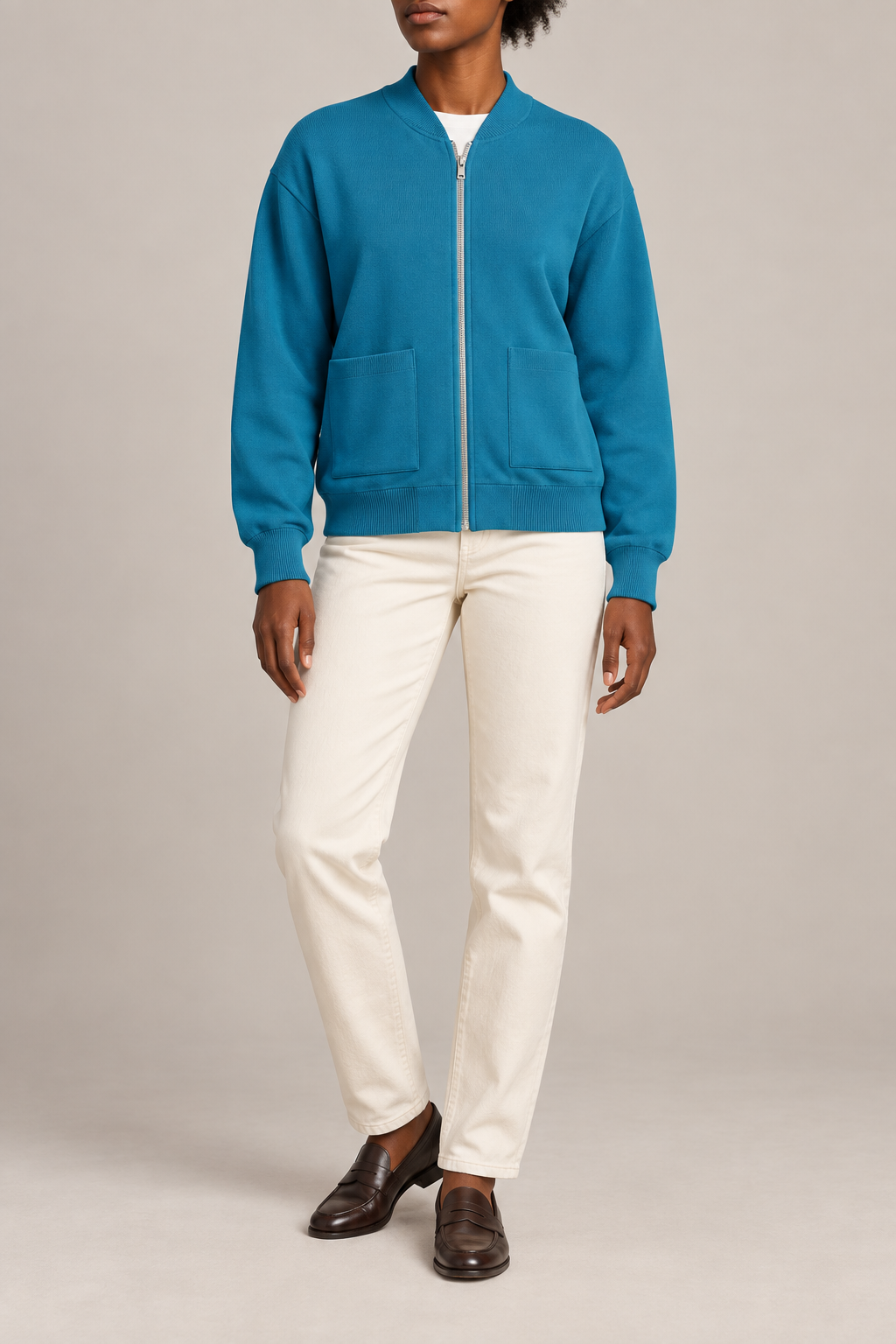 Front studio view showing full zip and front pockets of Soft Afterlight Knit Bomber in Cyan.