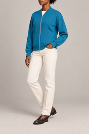 Three-quarter studio view showing the bomber silhouette of Soft Afterlight Knit Bomber in Cyan.