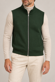 Still Form Zip Vest in Dark Green, elegantly layered on a male model, close front hero.
