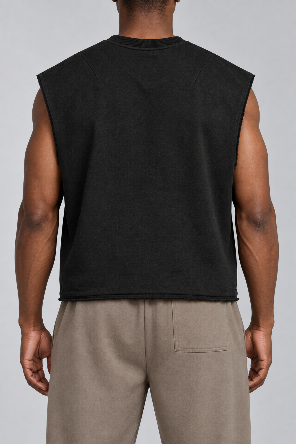 Rear studio view of Raw Form Terry Tank in Black, showing the plain back and two upper shoulder darts.