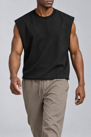 Walking view of Raw Form Terry Tank in Black, showing the natural drape and raw hem.