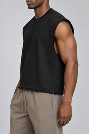 Side view of Raw Form Terry Tank in Black, showing the wide arm opening and short boxy silhouette.
