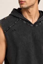 Detail of Soft Static Hooded Tank in Black, showing the hood neckline, raw shoulder seam and subtle distressing.