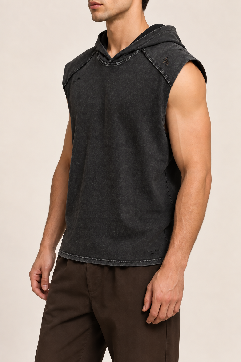 Three-quarter side view of Soft Static Hooded Tank in Black, showing the raw shoulder panel and loose washed silhouette.