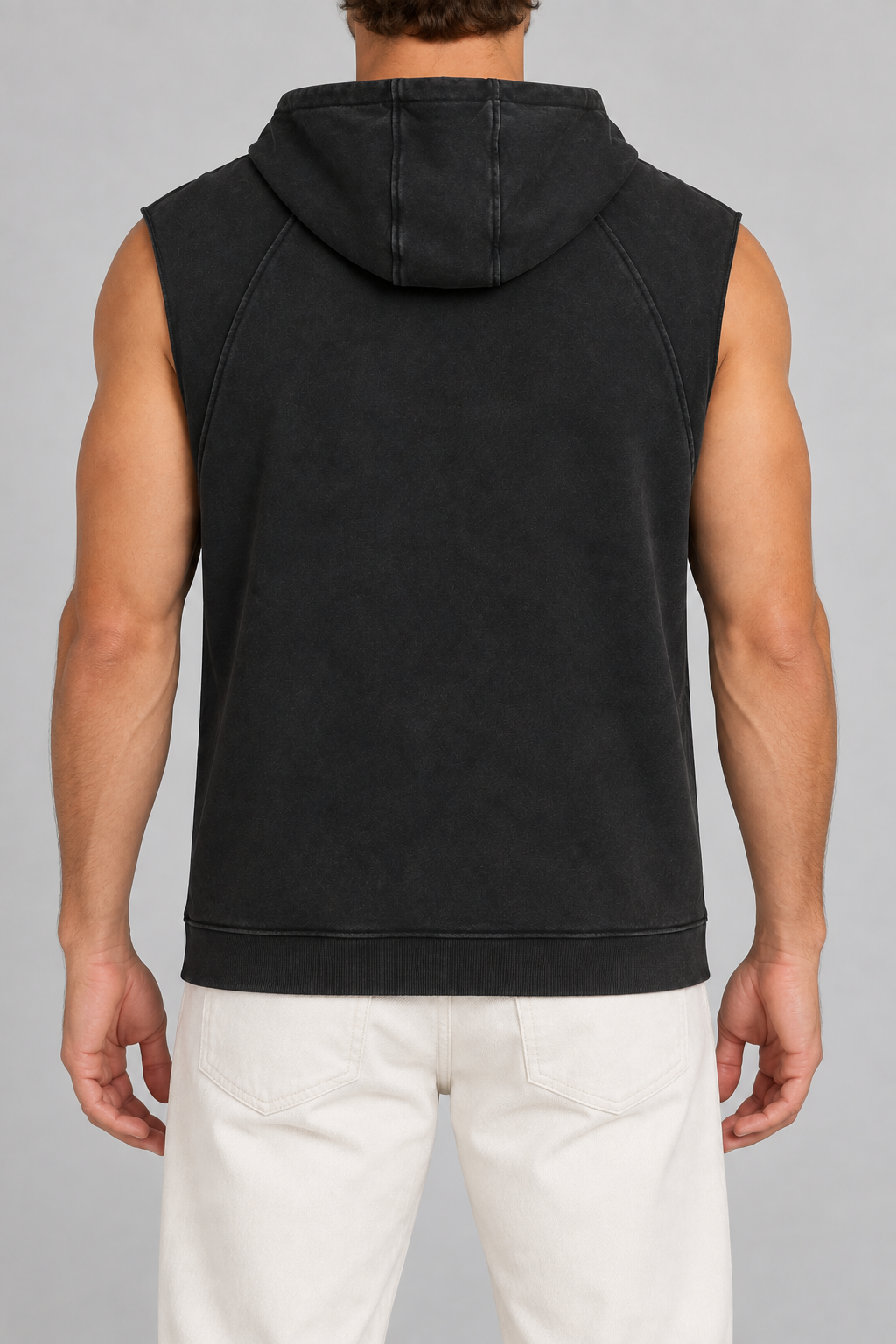 Rear view of Quiet Drift Sleeveless Hoodie in Black, showing the three-panel hood, plain back and ribbed hem.