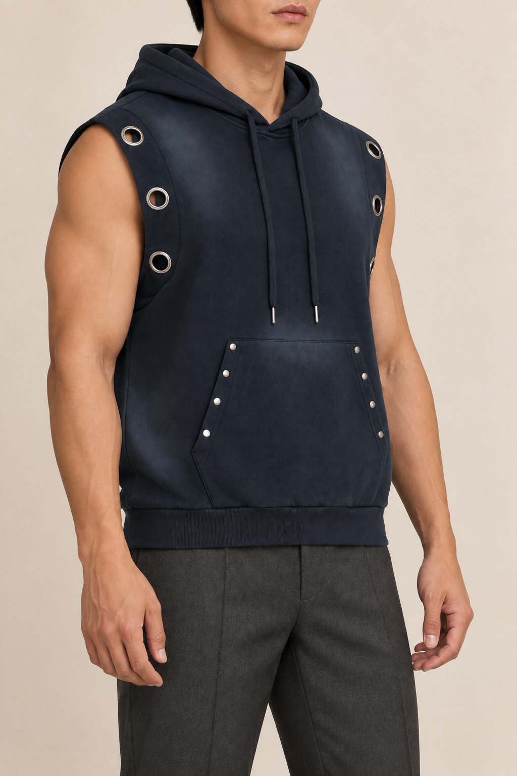 Three-quarter side view of Night Current Sleeveless Hoodie in Navy Blue, showing the eyelet armhole panel and studded pocket.
