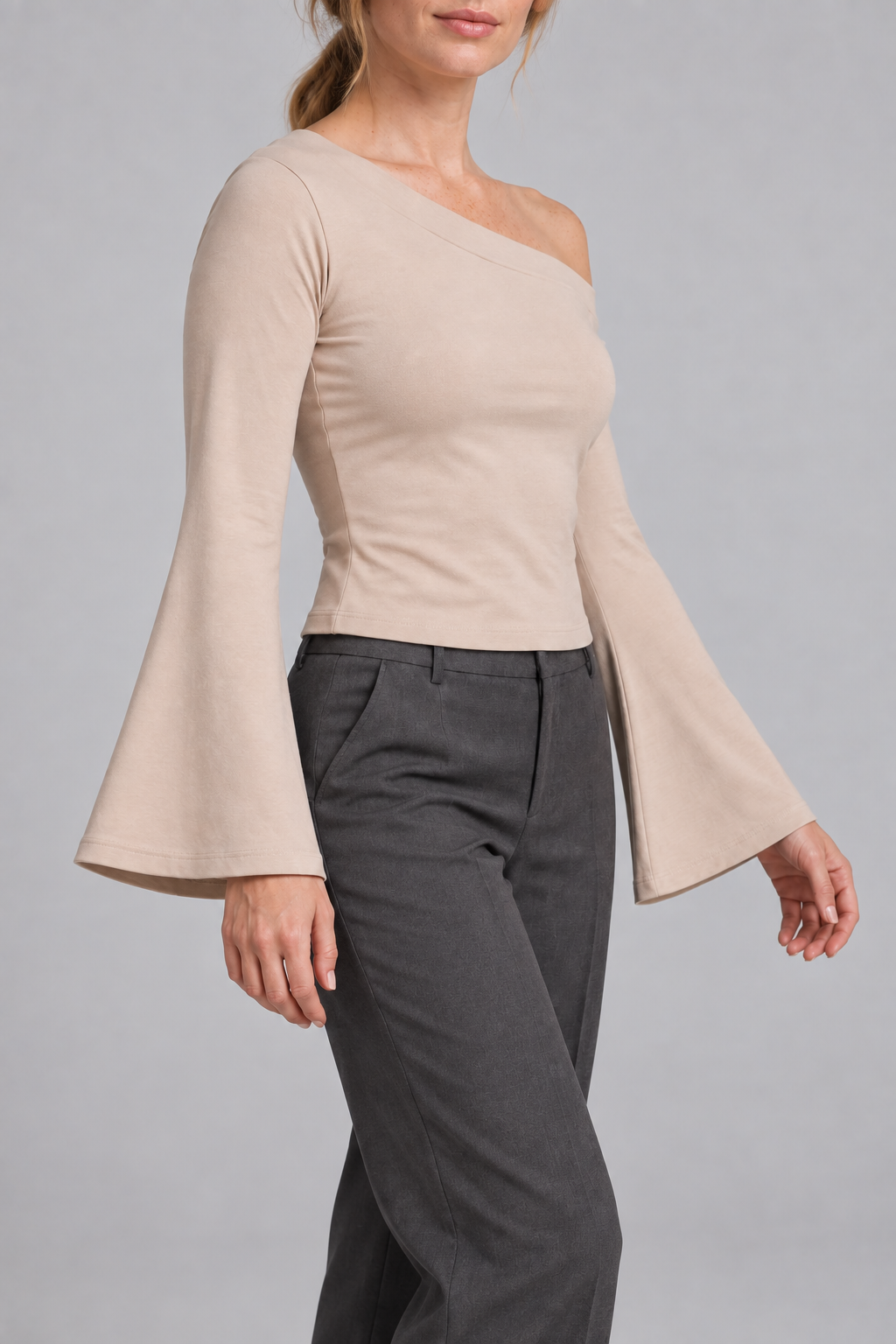 Quiet Arc Bell Sleeve Top in Pale Khaki. Three-quarter view showing the cropped fit and wide sleeve openings.