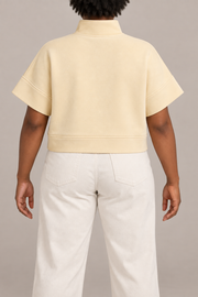 Soft Interval Zip Sweatshirt in Apricot. Rear view showing the plain back and cropped hem band.