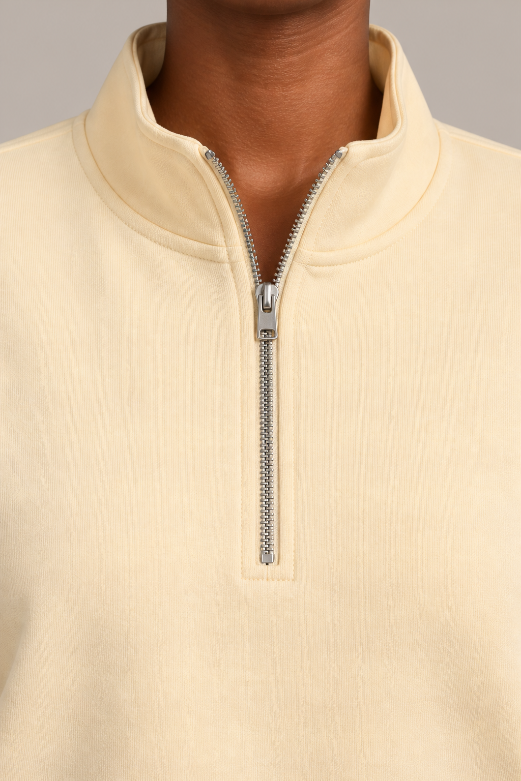 Soft Interval Zip Sweatshirt in Apricot. Collar detail showing the silver quarter zip and neat stitching.