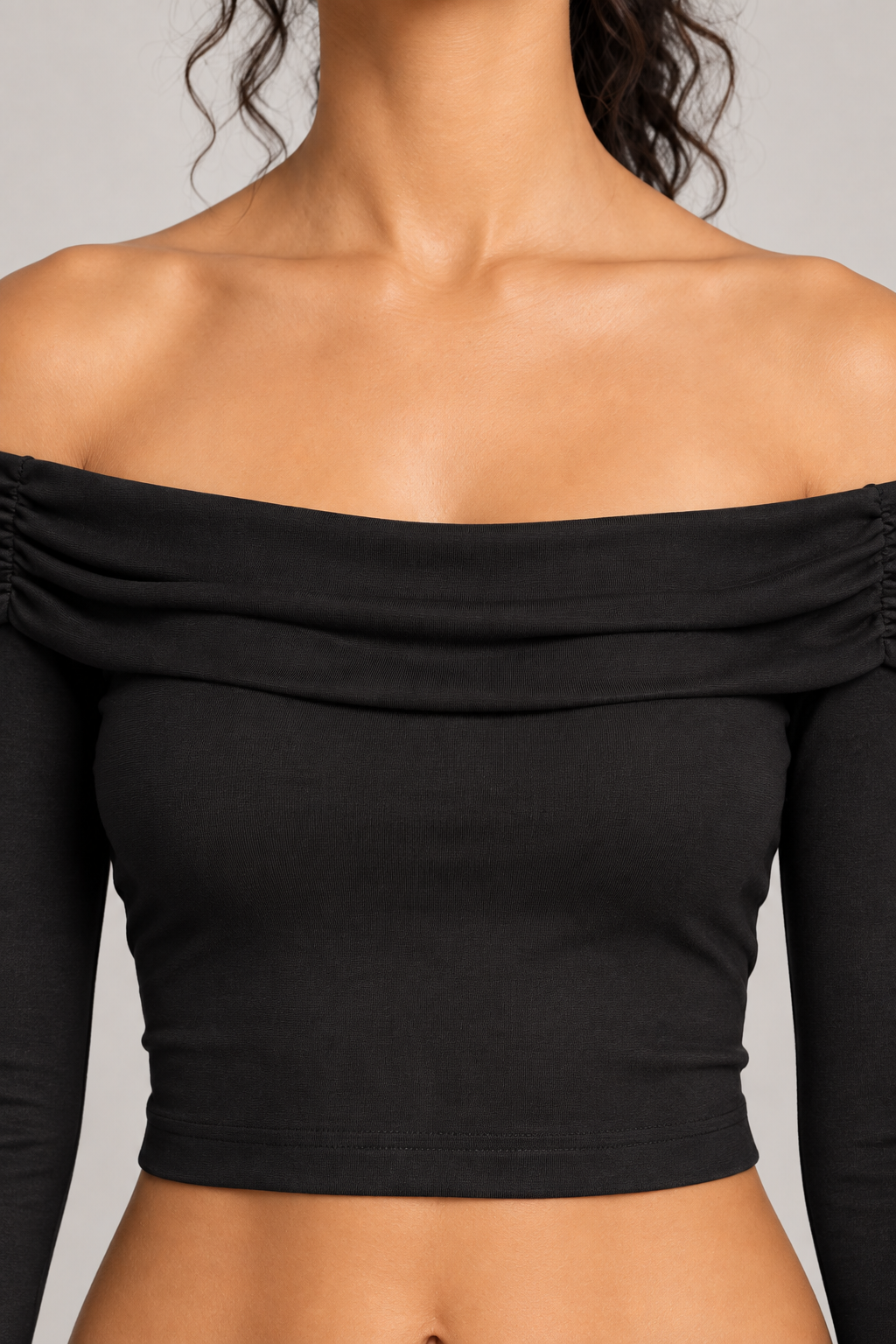 Quiet Fold Bell Sleeve Top in Black. Neckline detail showing the folded pleats and smooth black knit.