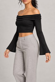 Quiet Fold Bell Sleeve Top in Black. Three-quarter view showing the gathered neckline edge and cropped fit.