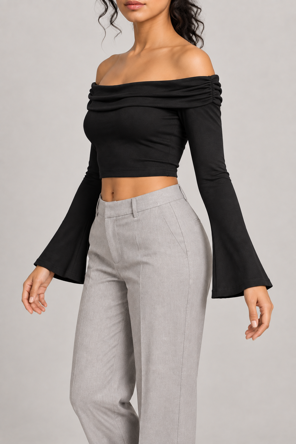 Quiet Fold Bell Sleeve Top in Black. Three-quarter view showing the gathered neckline edge and cropped fit.