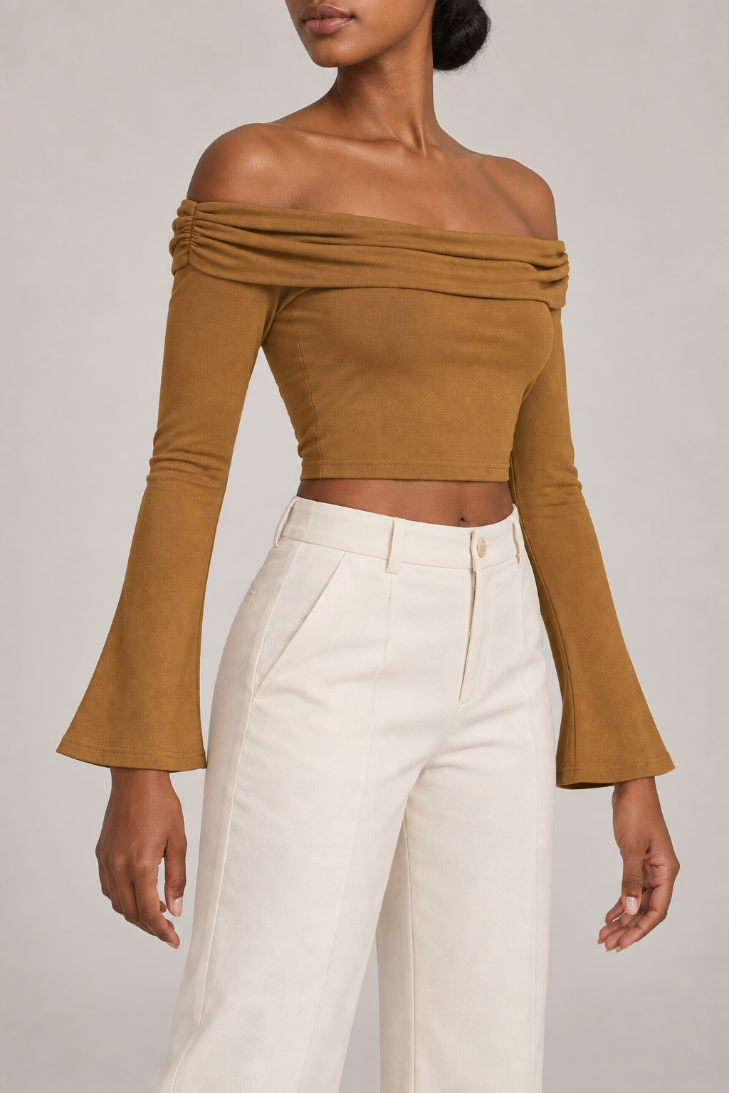 Quiet Fold Bell Sleeve Top in Brown. Three-quarter view showing the cropped body and flared sleeve opening.