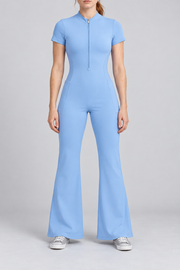 Contour Flare Zip Jumpsuit in Blue. Front studio view showing the short zip, mock neckline and full flared silhouette.