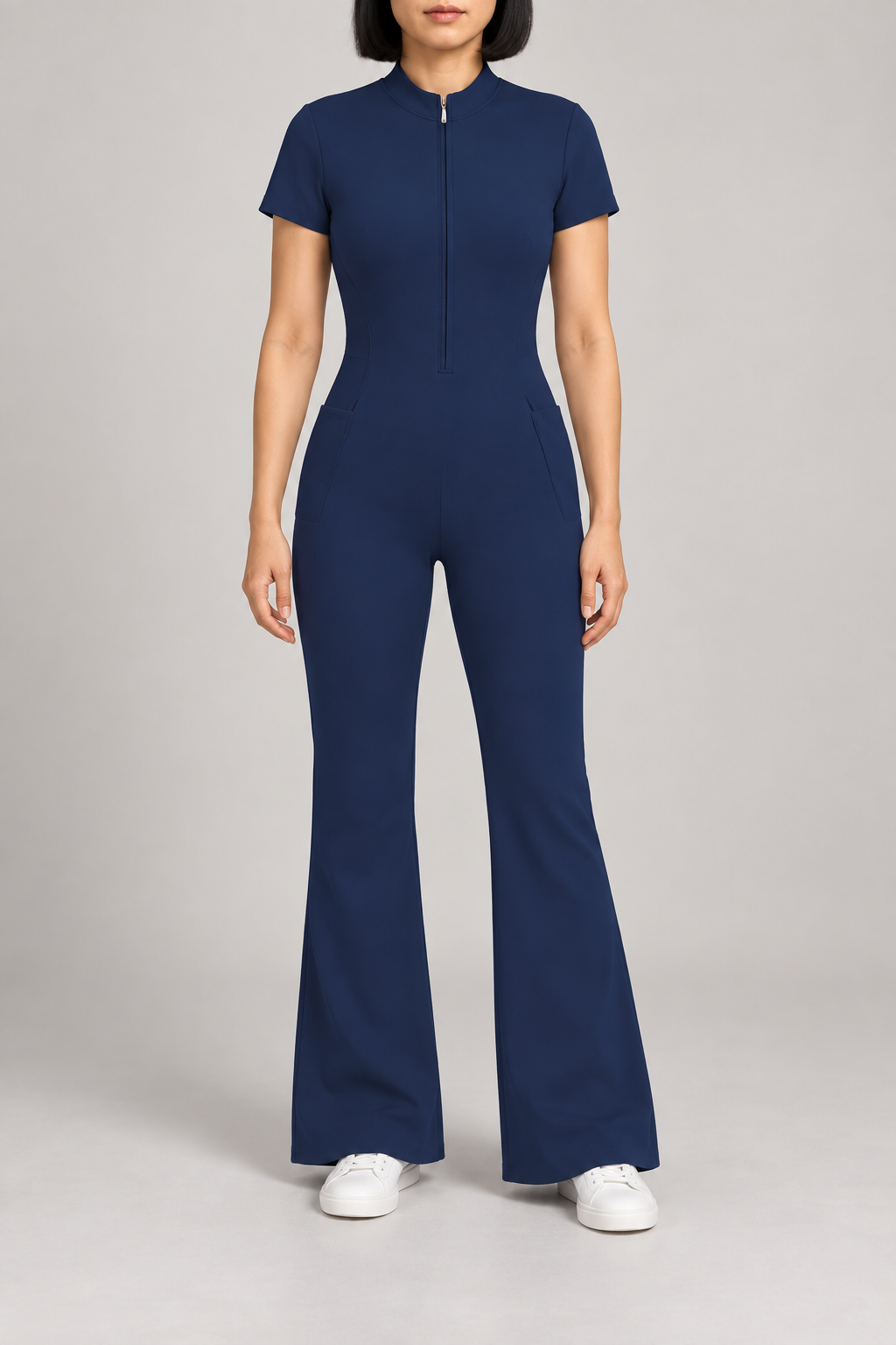 Contour Flare Zip Jumpsuit in Royal Blue. Front studio view showing the short zip, mock neckline and plain flared silhouette.