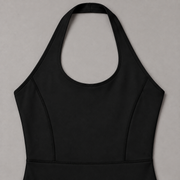 Open Line Halter Jumpsuit in Black. Flat-lay close-up showing the halter neck loop, bound edging and shaped bodice seams.