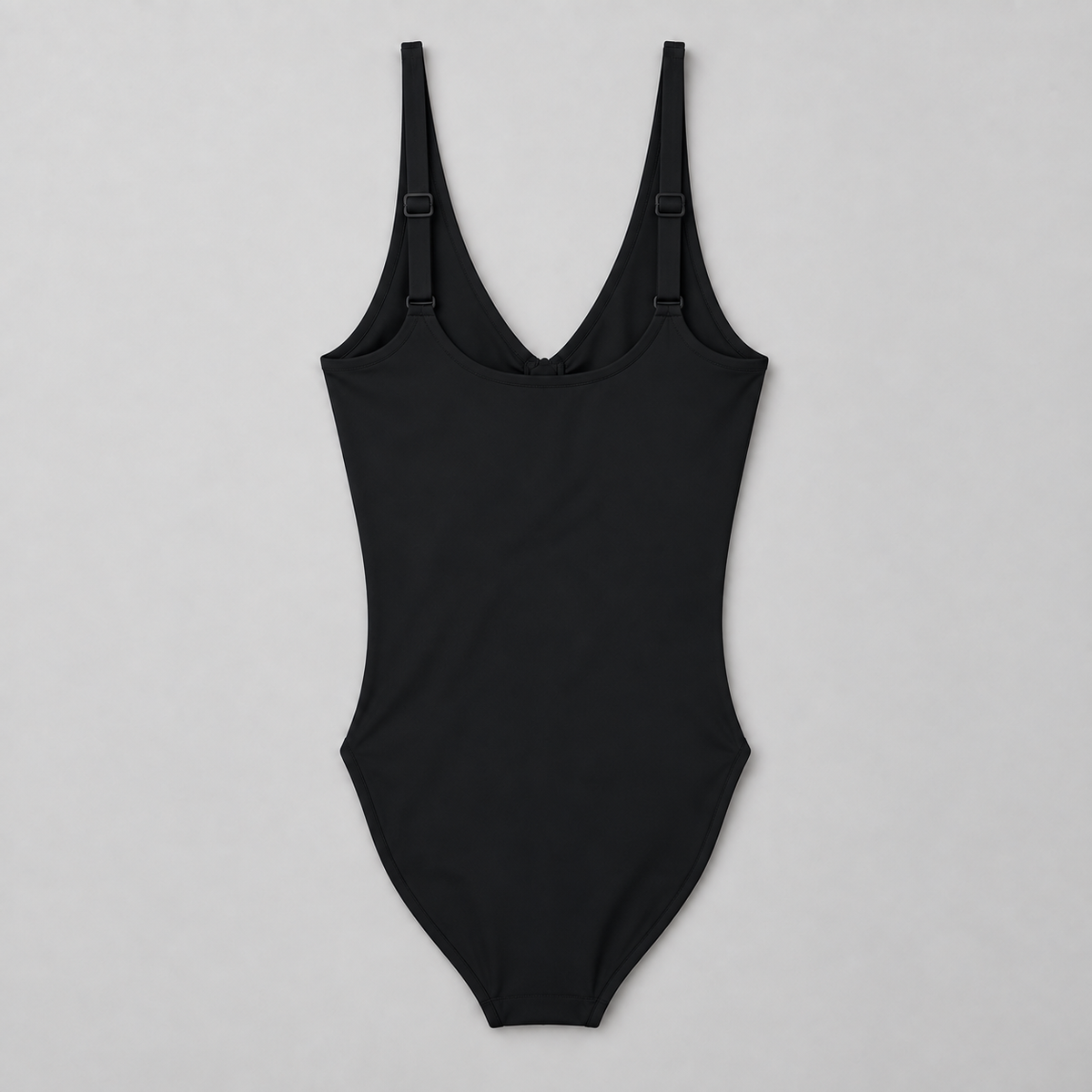 Soft Gather Zip Bodysuit in Black. Rear flat-lay studio view showing the plain back and adjustable shoulder straps.