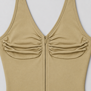 Soft Gather Zip Bodysuit in Khaki. Close-up studio view showing the ruched fabric, V-neck edging and matching zipper.