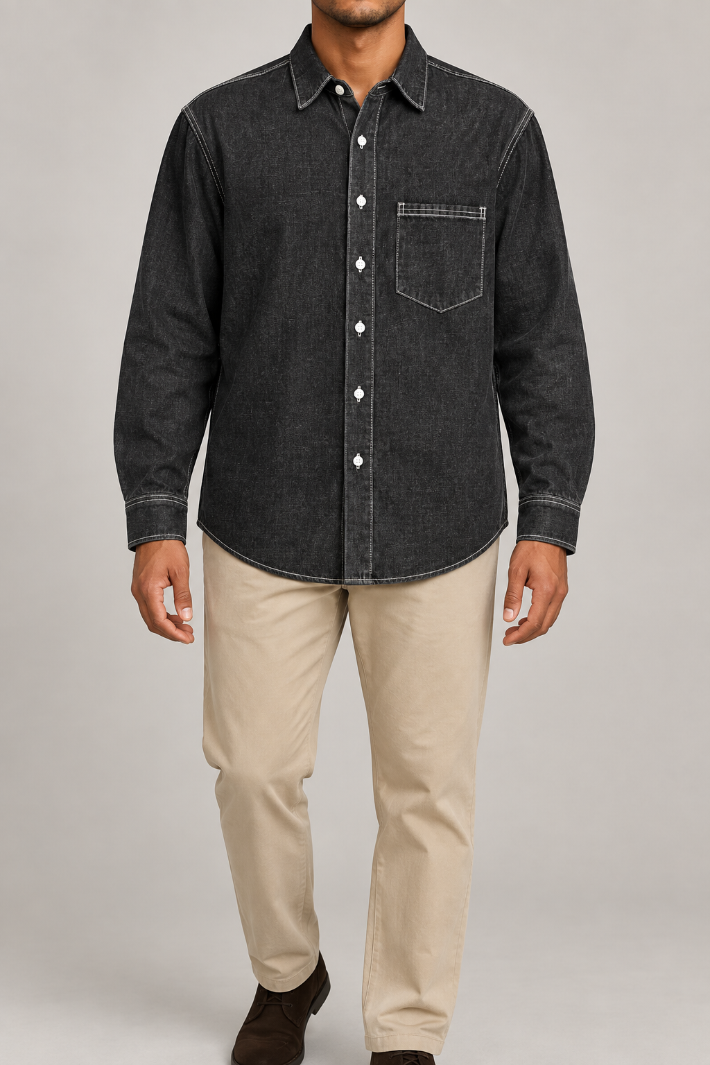 Front studio view of Worn Line Denim Shirt in Black, showing its plain washed finish, white buttons and single chest pocket.